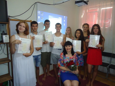 miss_irene_awards_certificates_to_students.jpg